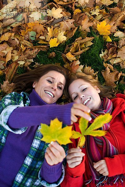 Mother daughter and autumn leaves Sweden.