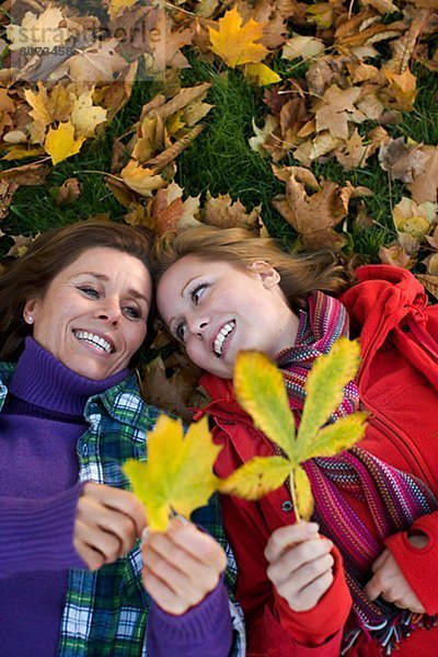 Mother daughter and autumn leaves Sweden.