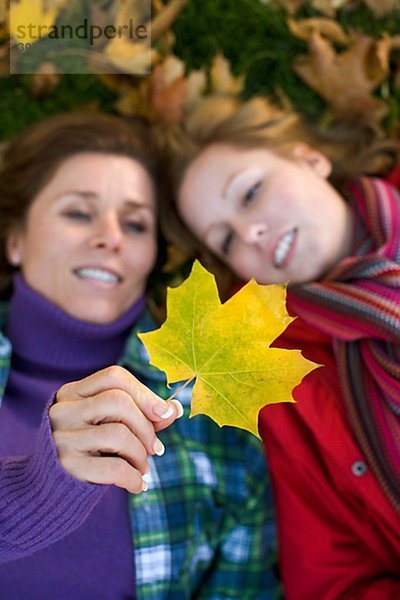 Mother daughter and autumn leaves Sweden.