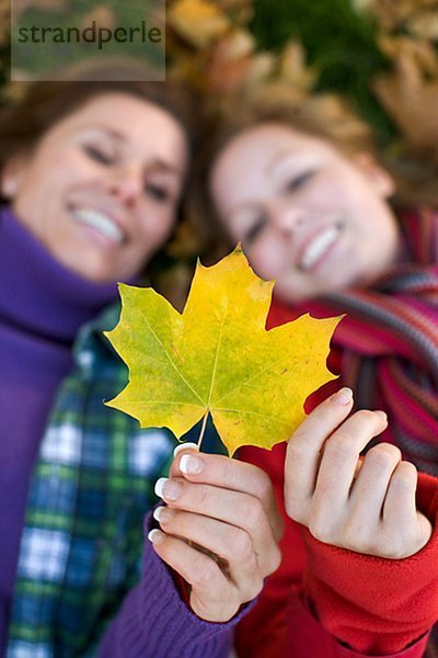 Mother daughter and autumn leaves Sweden.