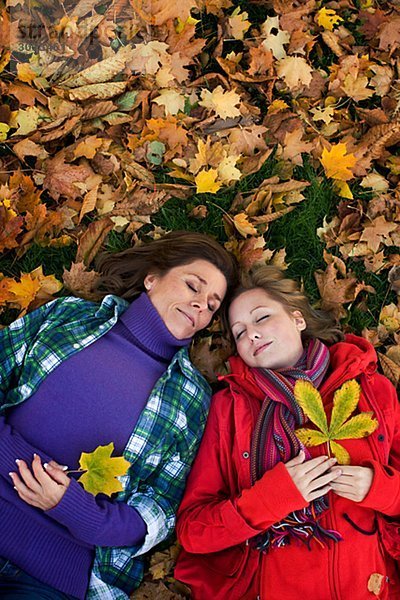 Mother daughter and autumn leaves Sweden.