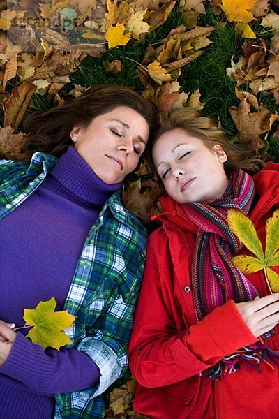 Mother daughter and autumn leaves Sweden.