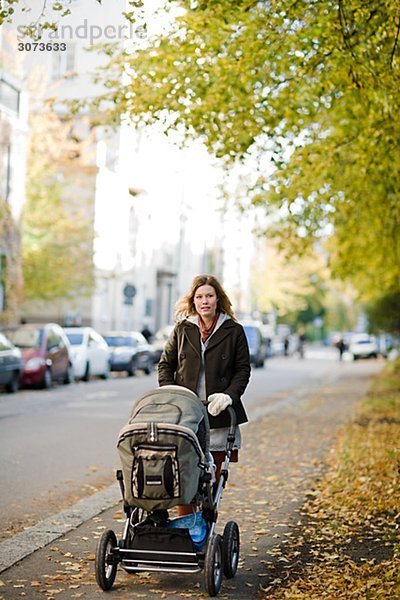 Mother with preambulator Sweden.