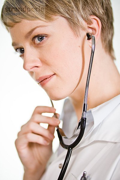 A female doctor using a stethoscope Sweden.