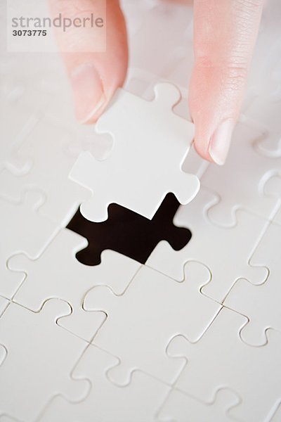 A puzzle with a missing piece.