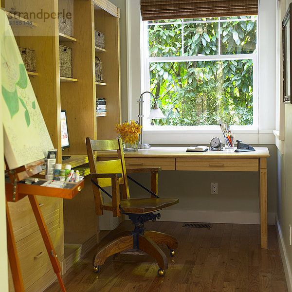 Home office with painting easel in foreground  Victoria  British Columbia