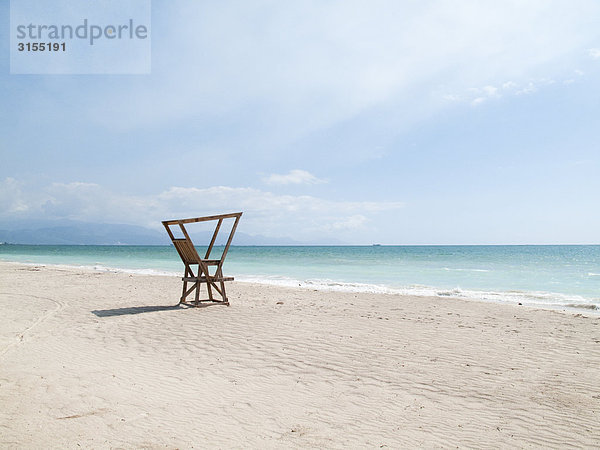 Chair on beach  Kingston  Surrey  Jamaica