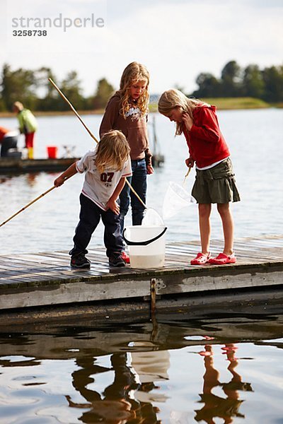 Children on a jetty  Sweden.