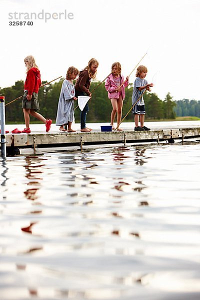 Children on a jetty  Sweden.