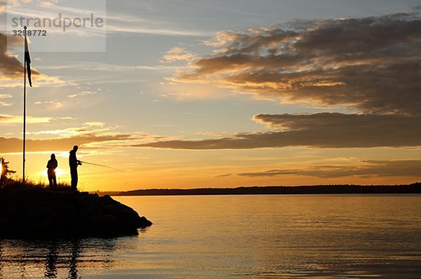 Sonnenuntergang Silhouette Mensch angeln zwei Personen 2