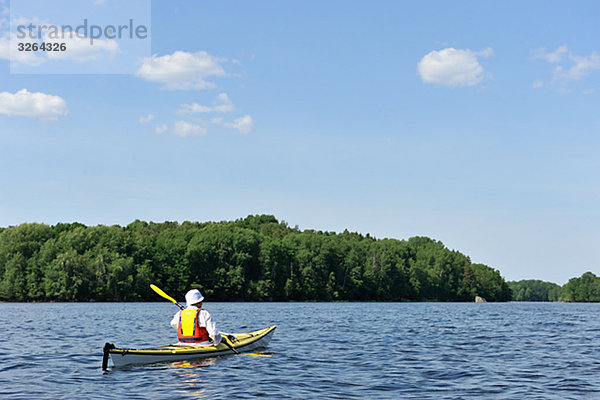 A person paddling kayak  Sweden.