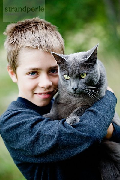 Junge mit seine Katze  Schweden.