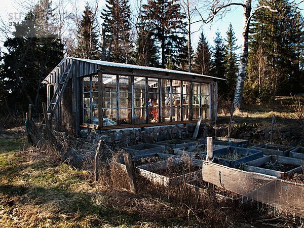 A glasshouse in a garden  Sweden.