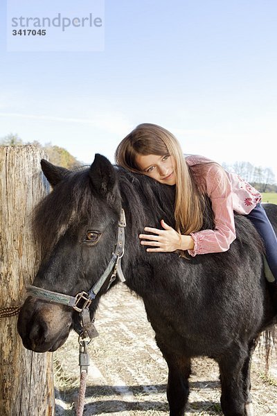 Mädchen zu Pferd
