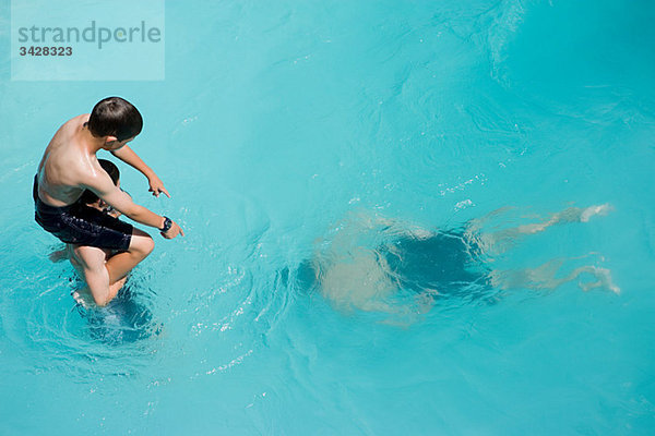 Boys playing in swimming pool  Auckland