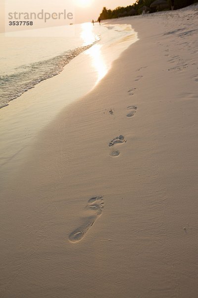 Fußabdrücke auf Sand Beach