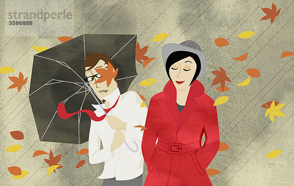 Mann und Frau in Herbststurm