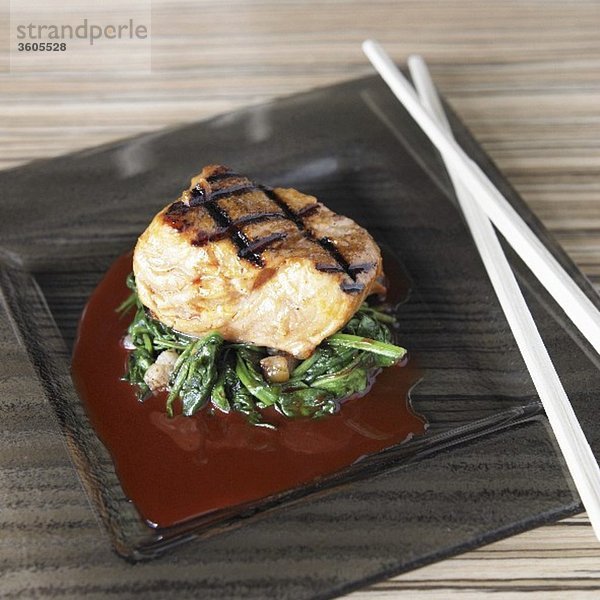 Grilled salmon fillet with greens  achiote and ponzu sauce