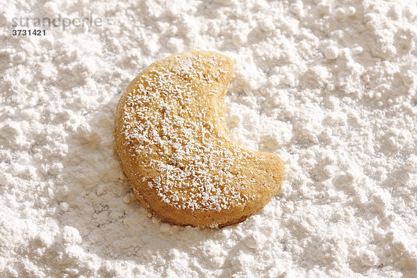 Shortcrust cookie  crescent on powdered sugar