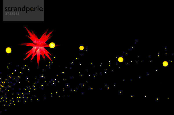 Weihnachtsbeleuchtung  roter Stern und gelbe Lampen