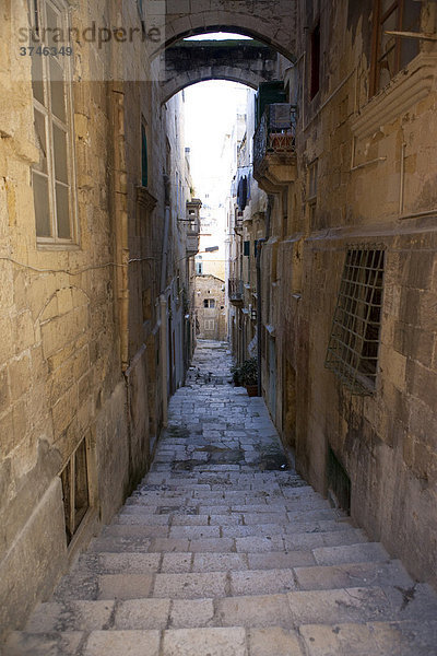 Narrow alley on St. Lucia Street  Valletta  Malta  Europe