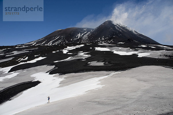 Black lava and snow  Mt. Etna  Sicily  Italy