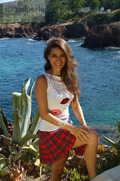 Young woman standing  EstÈrel Range on the Mediterranean  ThÈoule-sur-Mer  France  Europe