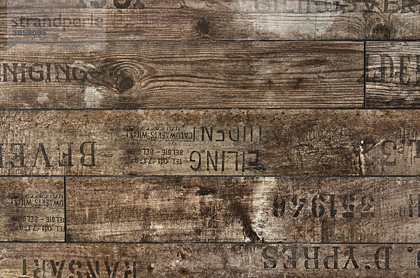 Holzbohlen mit Stempelaufdrucken  Hintergrund