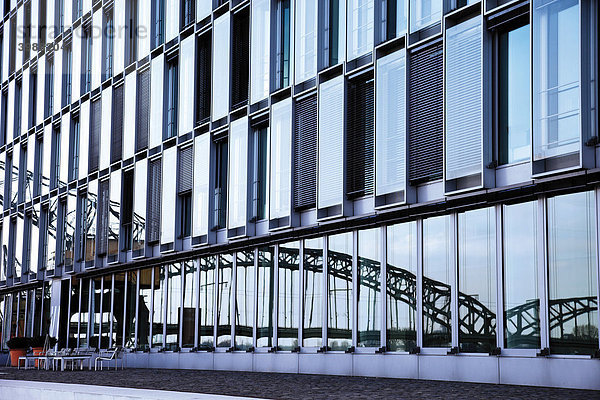 Spiegelung der Südbrücke in einer Glasfassade  Köln am Rhein  Nordrhein-Westfalen  Deutschland  Europa