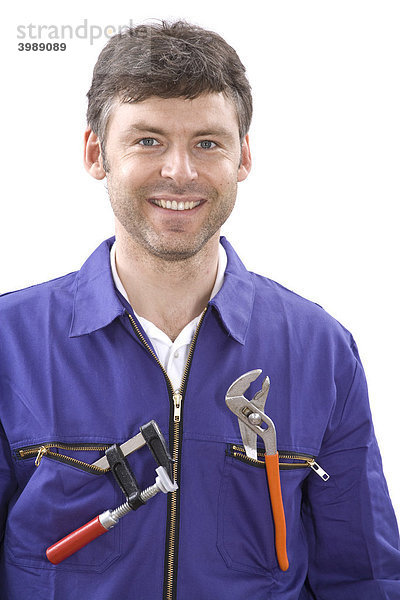 Handwerker im Blaumann mit Werkzeug