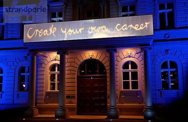 Schriftzug Create your own career  nächtliche Werbung an einem Haus  Berlin  Deutschland  Europa