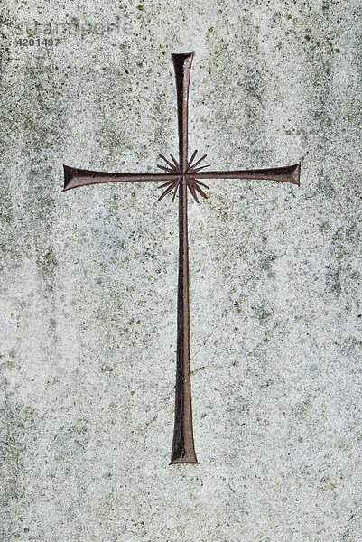 Detail of a grave stone with cross