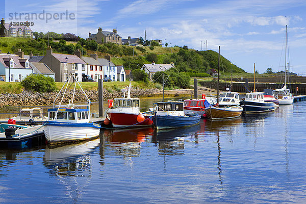 Helmsdale  Great Britain  Scotland  Europe  sea  coast  harbour  port  boats  fishing boats  reflection  village  houses  homes