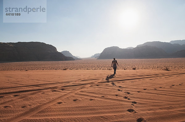 Jordan  Wadi Rum  Man walking through desert
