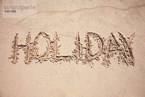 Text Urlaub geschrieben am sand