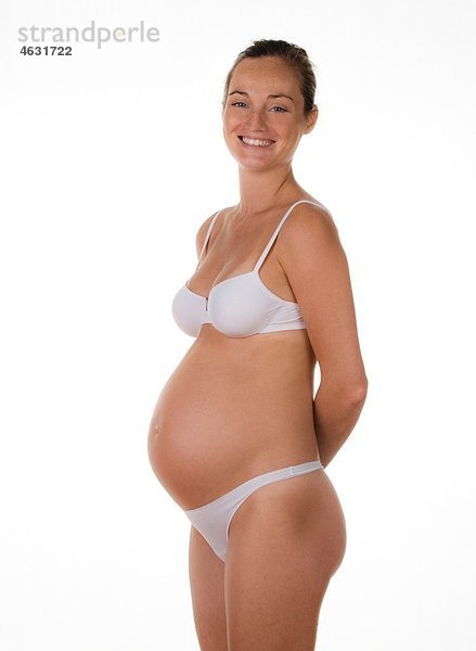 Junge schwangere Frau lächelnd  Portrait