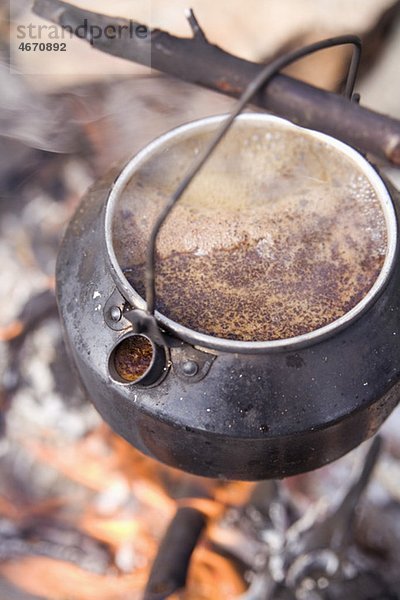 Kanne mit Kaffee am Stiel