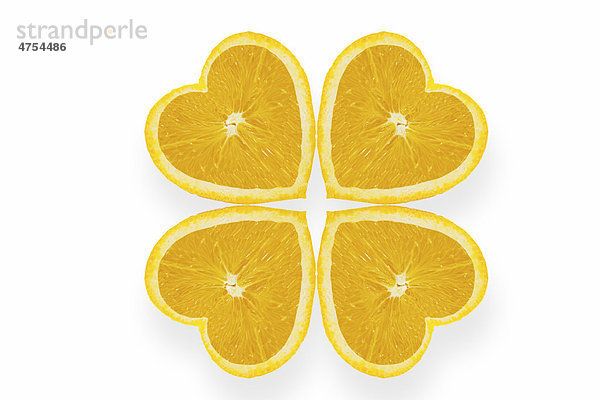 Orangen in Herzform bilden Kleeblattform