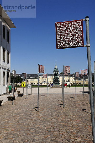 Schilder mit den Grundrechten am Platz der Grundrechte  hinten das Schloss  Karlsruhe  Baden-Württemberg  Deutschland  Europa