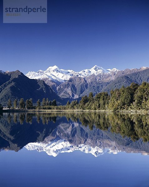 Urlaub  Lake Matheson  Landmark  Mount Cook  Neuseeland  Südinsel  Tourismus  Reisen  Ferienhäuser