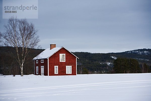 A red wooden house  Norrland  Sweden.