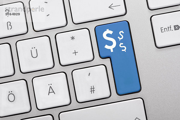 Abbildung der Tastatur mit blauer Taste mit Dollarzeichen  Nahaufnahme