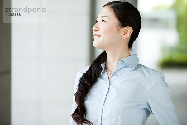 Portrait of young Businesswoman looking away