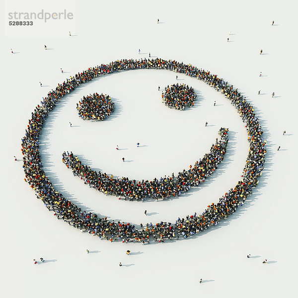 Luftbild einer Menschenmenge in Form eines Smileys