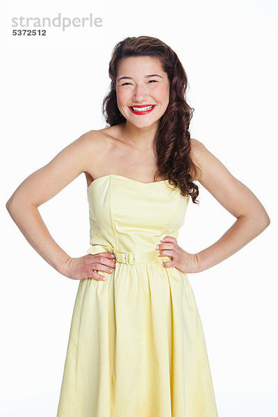 Young Woman standing against white background