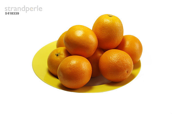 Orangen  Saftorangen auf gelbem Teller