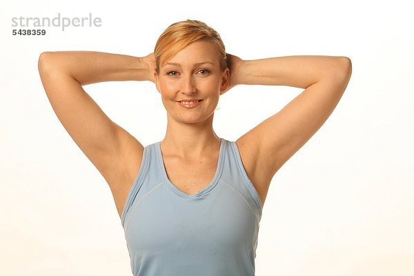Mobilisation des Schulter- Nackenbereichs - gegen Verspannungen und Schmerzen der Nackenmuskulatur - fördert die Durchblutung   schmiert das Schultergelenk - Junge blonde Frau kräftigt Ihre seitliche Nackenmuskulatur