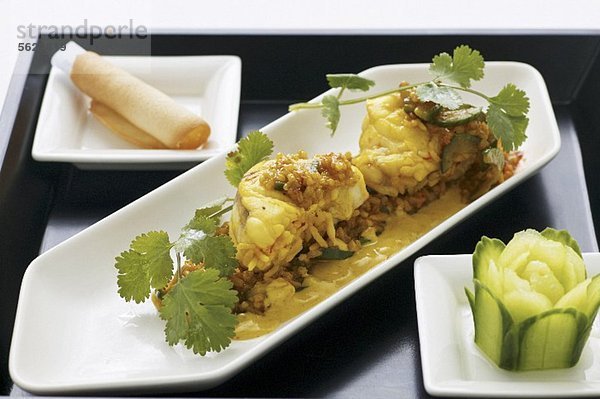 Gedämpfter Seeteufel mit Currysauce  Jasminreis und Koriander (Asien)