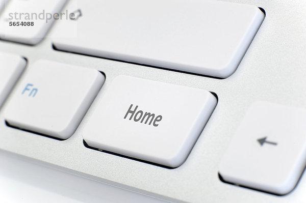 Moderne weiße Tastatur mit Schriftzug Home