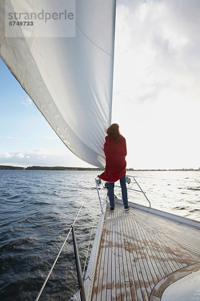 Woman standing by Segel Yacht